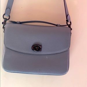 Grey coach bag available.